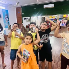 More happy faces and proud moments. The kids are excited to show off the mugs and gifts they received. These small rewards make their hard work feel special.