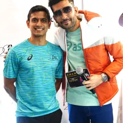 With Indian squash champion Saurav Ghosal at the Tata Mumbai Marathon press launch. Hosting sports events allows me to meet inspiring athletes.
