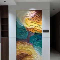 This large-scale abstract wall installation uses flowing, wave-like forms and a vibrant color gradient to bring life to a modern interior. The 3D texture is designed to catch light from different angles, creating a constantly changing visual effect that is both calming and energetic.