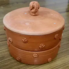 This is my custom-designed clay sprout maker. It's a healthy, eco-friendly alternative to plastic, designed with a two-tier system and an elephant-adorned lid for a touch of whimsy in your kitchen.