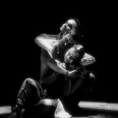 An intimate and powerful moment from 'Naga Mandala'. This black and white photo highlights the raw emotion and physical storytelling of the piece.
