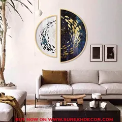 This unique, two piece semi circular crystal painting depicts a swirling school of fish in gold and blue against a contrasting black and white background. It forms a complete circle when hung together, creating a dynamic art piece.