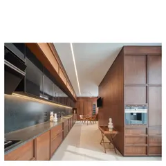 The kitchen in the Bombay Penthouse, designed for entertaining. We used all Indian materials, including salvaged teak for the cabinetry and granite for the worktops, to create a space that is both functional and beautiful.