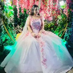 Your fairytale moment awaits. This client looks like a princess in a beautiful white and pink floral embroidered ball gown, rented for her special event.