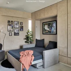 Here is the Murphy bed in its sleeping configuration. The transition from couch to bed is seamless, and the surrounding paneled wall conceals the mechanism, keeping the look clean and modern.