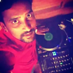 An old selfie from behind the decks with a classic vinyl turntable. Long before digital took over, I was spinning records and honing my skills as a selector and mixer.