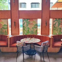 For The Koha restaurant, we created these tropical art panels on tiles to complement the warm, earthy tones of the interior. The artwork provides a beautiful backdrop for the plush seating booths.