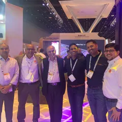 Our team networking with industry partners and clients at a professional trade show. We prioritize building strong relationships and staying connected with the latest innovations in event technology.