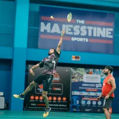 An employee from Gameskraft executes a perfect jump smash during their corporate tournament. Our professional grade courts with teak wood flooring and excellent lighting allow players to perform at their best.