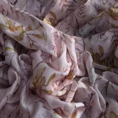 This printed muslin fabric in a soft pink hue features a delicate leaf print, offering a breathable and story-like quality to your garments.