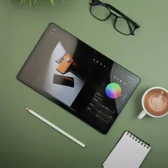 This flatlay showcases the realme Pad 2 being used for photo editing, highlighting its large screen and creative potential for artists and photographers.