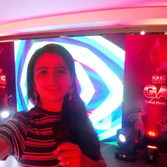 A selfie from the Dell "Be The Game" corporate show. The vibrant stage setup reflects the high-energy atmosphere I create through engaging icebreakers, team activities, and celebrating the participants' competitive spirit.