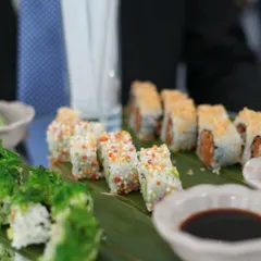 A platter of assorted sushi, beautifully presented on a banana leaf. This dish, served at IIFA, highlights our expertise in global cuisines, bringing authentic Japanese flavours to any event.