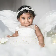 A little angel among the clouds. For baby milestone sessions, I love creating dreamy, whimsical setups like this one to capture the pure innocence and magic of your baby's first year.
