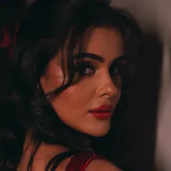 Priyanka owning the color red. A close up of her bold red lip and classic winged eyeliner, a timeless and powerful combination for any event.