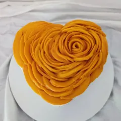 This heart-shaped mango cheesecake shows my love for beautiful presentation. Each slice of sweet Alphonso mango is carefully layered to form an edible rose, making it a stunning centerpiece for any special occasion.