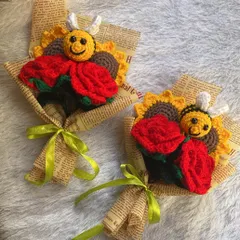 A pair of cheerful mini-bouquets. Each one features a bright red rose, a sunflower, and a happy little bee, making it a perfect small gift to brighten someone's day.