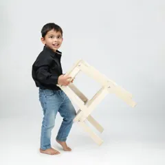The playful energy of a toddler is just the best. This candid shot captures his happy expression and movement, creating a memory full of life.