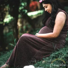 A serene moment from a maternity photoshoot. I created a very soft, natural makeup look to enhance her features while keeping the focus on the beautiful and peaceful emotion of the moment.