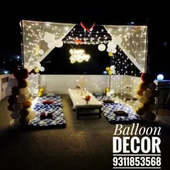 I can turn any terrace into a magical, starlit dining experience. This romantic birthday setup features a canopy draped with fairy lights, low seating with comfortable cushions, and elegant balloon decor for a private and unforgettable celebration.