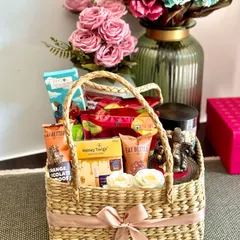 This healthy and wholesome Diwali basket is perfect for the health-conscious. It's filled with green tea, a Ganesh ji idol, berry mix, roasted chips, makhana, and honey twigs, offering a guilt-free way to celebrate the festival.