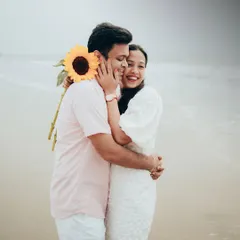 Pre-wedding shoots should be fun and reflect your personality. This candid shot captures a moment of pure joy and laughter during a relaxed, casual pre-wedding session on a Mumbai beach.