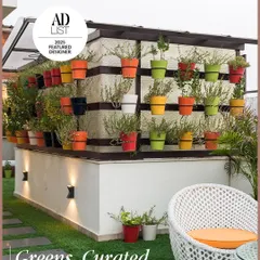Where design meets nature in perfect balance. We don't just add greenery; we compose it. This curated vertical garden with subtle up-lighting creates tranquil moments in a modern outdoor setting.