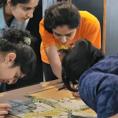 Our dedicated team working together on a concept design model. This collaborative, hands-on approach is crucial for refining the details of a master plan and ensuring every element works in harmony.