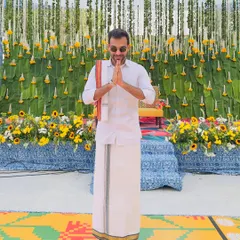 Greeting guests with a traditional 'namaskaram' at a South Indian themed wedding. It's these small cultural details that make a themed event feel truly authentic.