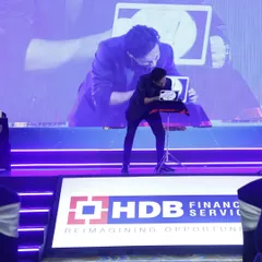 Here at the HDB Financial Services IPO success party, I'm performing my iPad magic. This form of digital illusion is perfect for both stage and close-up settings, allowing me to bring the magic directly to your guests.