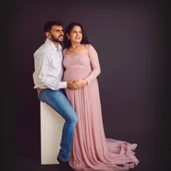A candid moment of the couple looking towards their future together. We styled this shot with our elegant pink lace gown against a simple backdrop to keep the focus on their connection.
