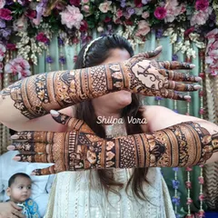 Another angle of the full bridal arms, showing the consistency of the patterns and the overall impact of the design.