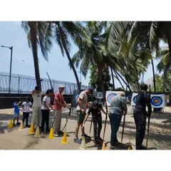 A group of archers lines up during our summer camp. The outdoor setting provides a great atmosphere for learning and practicing.