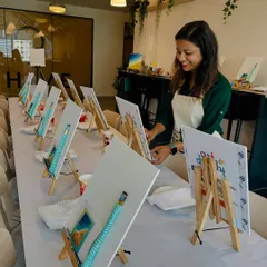 Setting up the easels for a corporate art event. I ensure everything is ready for a smooth, creative, and inspiring session for the team.