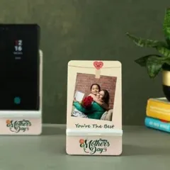 A practical and personal gift for Mother's Day. This custom mobile phone stand holds a device securely while displaying a sweet photo and a "Happy Mother's Day" message.