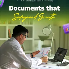The right documents safeguard your growth. This image of a professional reviewing charts and legal papers represents our meticulous approach to creating franchise agreements and SOPs that protect your vision.