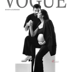 A creative, magazine-style couple's portrait designed to look like a Vogue cover. This black and white shot captures the modern, chic style we can achieve for parents-to-be who want something unique.