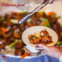 Delicious food is the reason for every perfect celebration. This image captures a guest with a beautiful henna design enjoying a plate of our food, embodying the spirit of celebration.