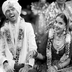 A black and white photo often brings out the true emotion of a moment. Here, Parth's joyful laugh and Jhanvi's sweet glance are frozen in time, creating a classic, timeless memory of their wedding day.