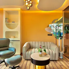 My cozy waiting area, designed for you to relax and connect before or after your class. The warm colors and comfortable seating create a tranquil atmosphere.