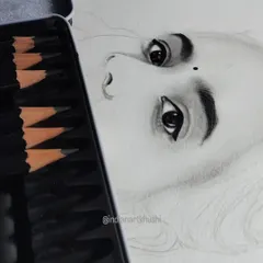 A work-in-progress shot of a portrait. You can see how I start with the eyes, as they are the soul of any sketch. This detailed layering process is key to achieving a realistic effect.
