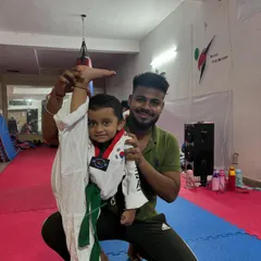 Even the smallest champions can have the biggest spirit. Here, I am helping a three year old student with her flexibility and kicks. My academy is a place for everyone, starting from age 3, to grow strong.