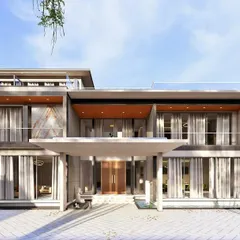 A look at the grand entrance of an upcoming luxury project. The design emphasizes open, flowing spaces with floor-to-ceiling glass, connecting the interior directly to the paved courtyard and surrounding landscape.