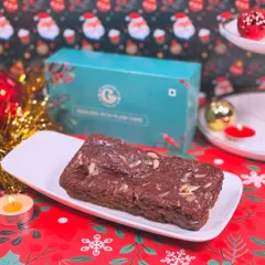 Our Eggless Rich Plum Cake is a holiday essential. It's packed with soaked fruits and spices, making it the perfect dense and flavorful Christmas treat.