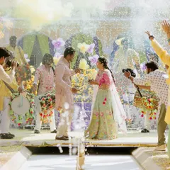A moment of pure joy at a vibrant Haldi ceremony. We orchestrate multi-day celebrations where each event has its own distinct energy, capturing the couple's personality through custom decor, lively entertainment, and perfectly timed moments like this celebratory color splash.