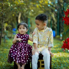 The sweet bond between siblings captured during a relaxed outdoor photoshoot in a Bangalore park. We love creating a fun atmosphere where kids can be themselves, resulting in genuine smiles and candid family portraits.