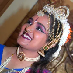 A close-up of a Bharatanatyam dancer, capturing the intense emotion and intricate details of her makeup and costume. My performance arts photography aims to freeze the grace and expression of the artist in every shot.