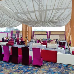 A mix of lounge sofas and classic covered chairs, showing how I can create different seating zones within a single large wedding tent.