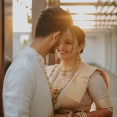 Backlit by the golden hour sun, this close-up captures the pure joy and affection between the couple. Her beautiful smile and the soft focus create a dreamy, romantic portrait that feels warm and timeless.