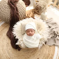 Pure and simple. A sleeping baby in a nest of soft, natural textures. These boho-inspired newborn sessions have such a warm and earthy feel.